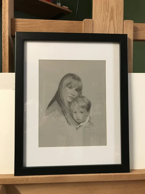 Mother and child portrait in black frame